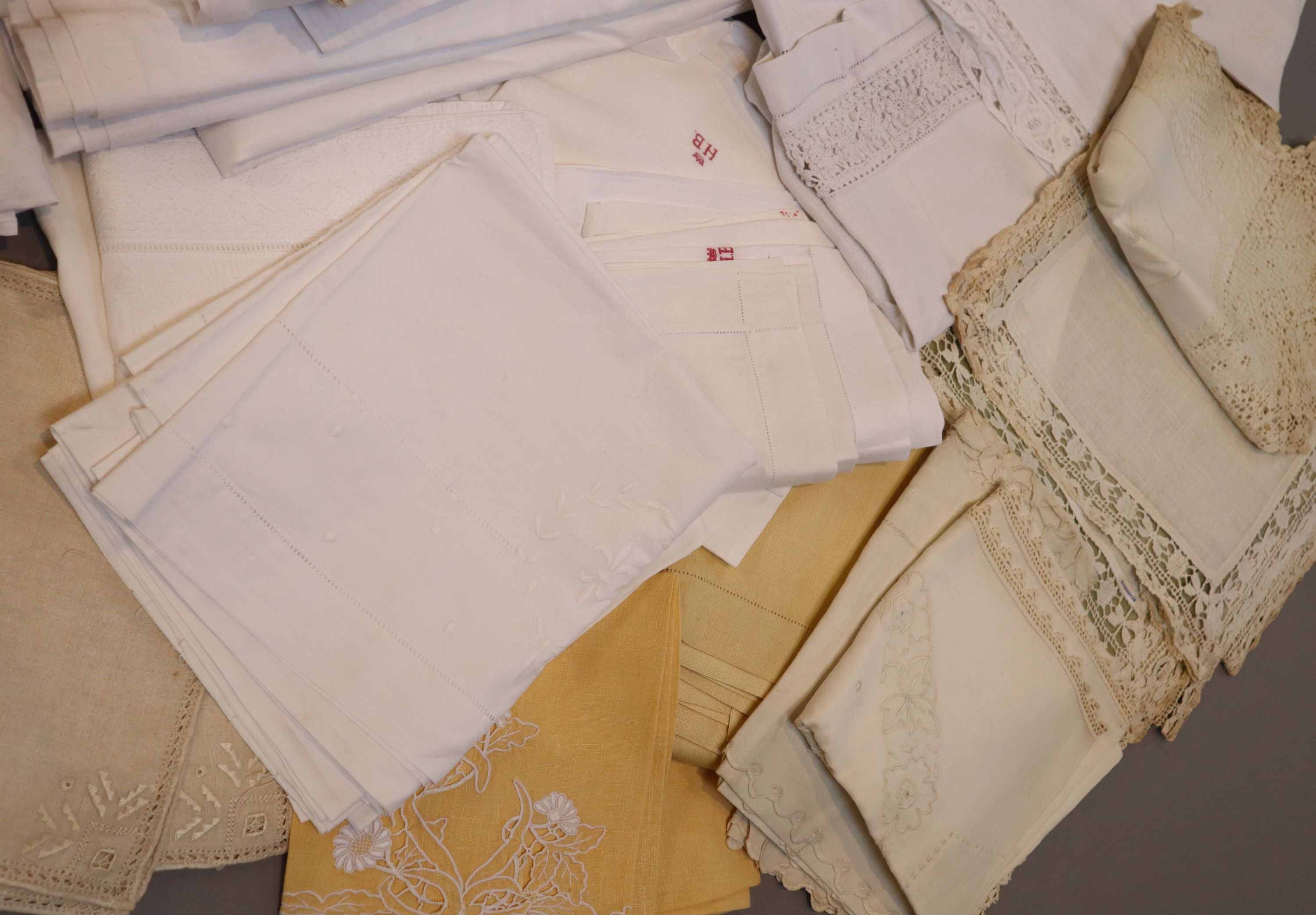 A quantity of linen sheets and embroidery